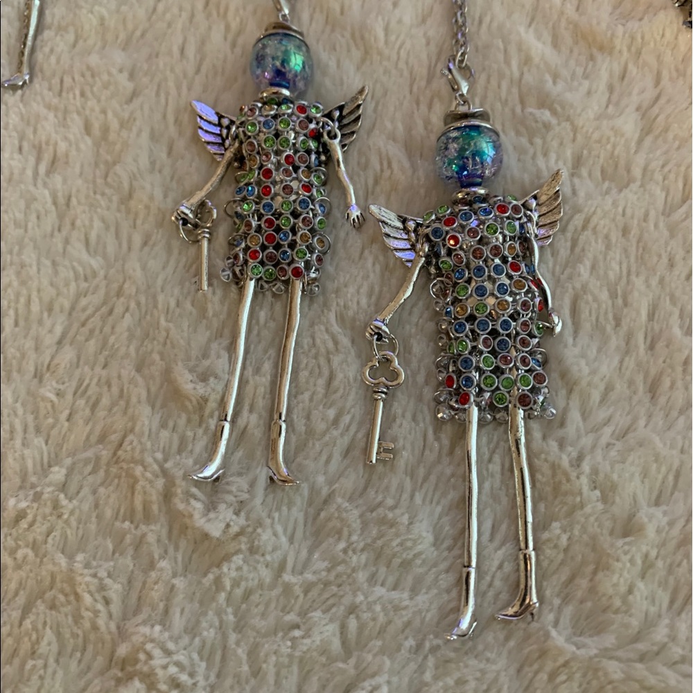 Necklace or earrings or zipper pull.